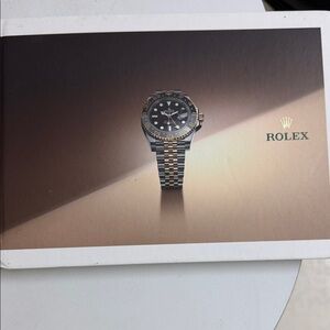 Rolex catalog book Rolex 2023/24Two-Tone Watch with Black Dial and Gold Accents